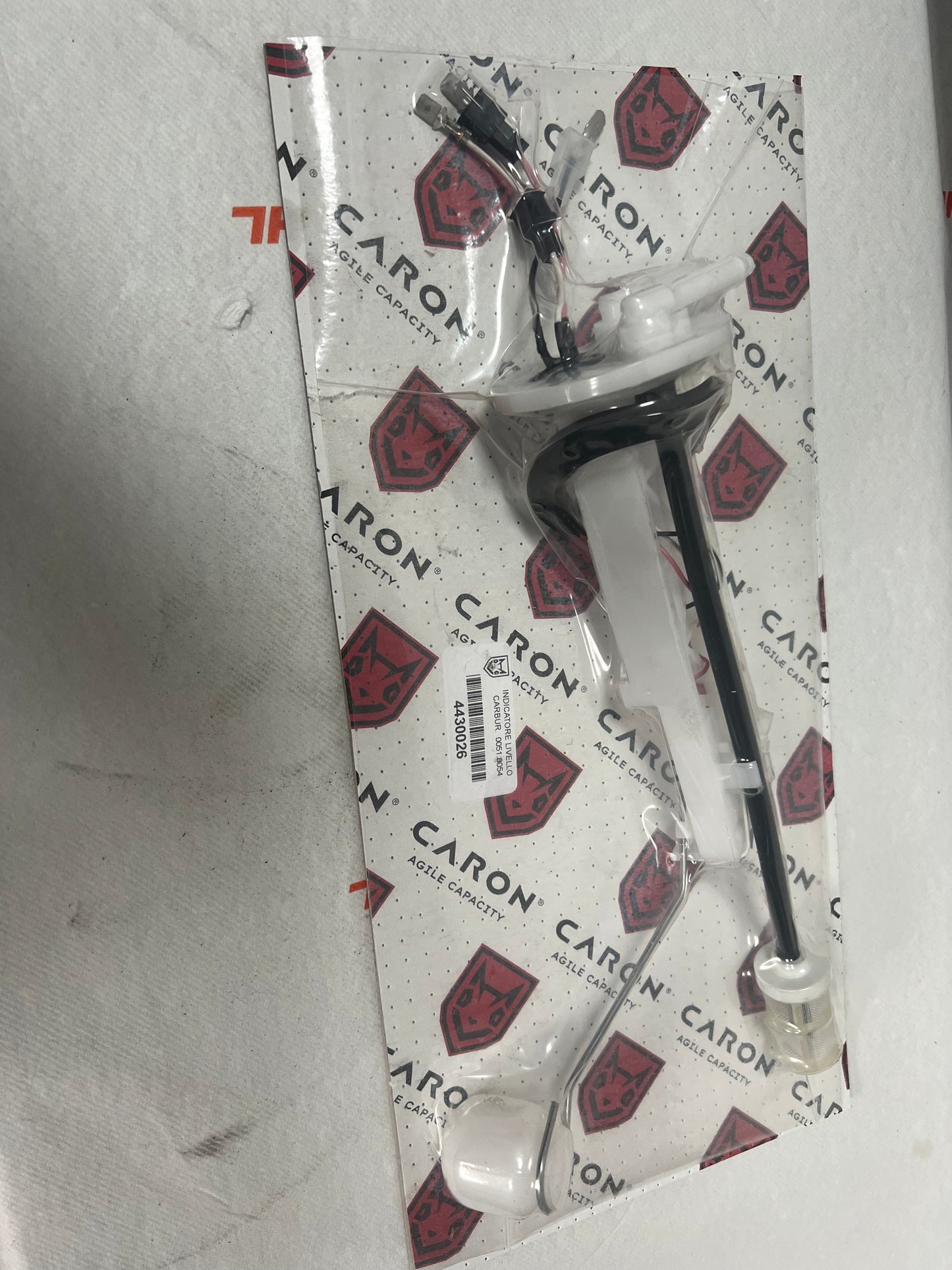 Indicatore livello carburante Caron 00518054 ricambio completo in plastica bianca e nera