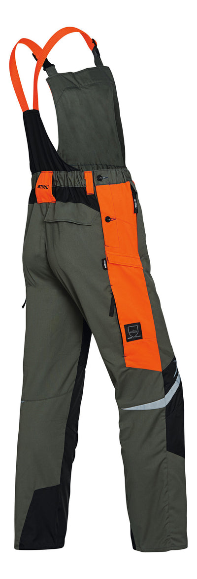 Salopette antitaglio Stihl Function Ergo verde e arancione con bretelle e inserti riflettenti vista posteriore